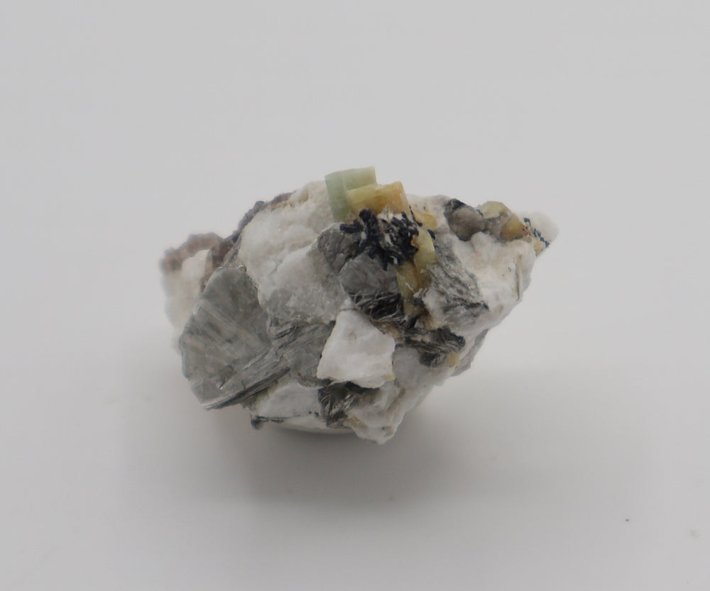 Aquamarine and Heliodor with Hematite, Mica, Smoky Quartz, on Feldspar