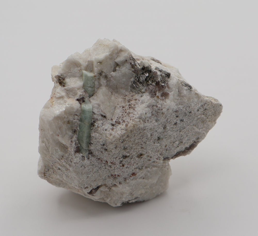 Aquamarine with Spessartine Garnet, Mica, Smoky Quartz, on Feldspar