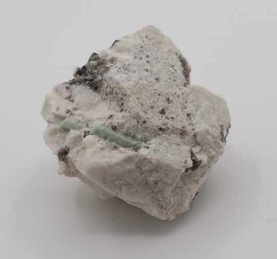 Aquamarine with Spessartine Garnet, Mica, Smoky Quartz, on Feldspar